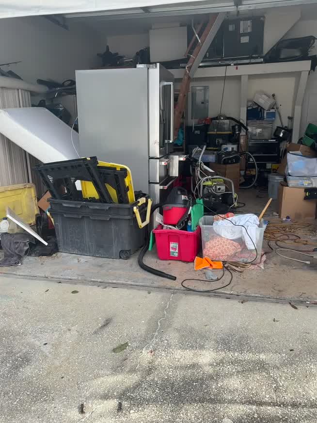 Before — This client wanted a clean, organized garage where she could access everything she owns and finally park her car inside again.