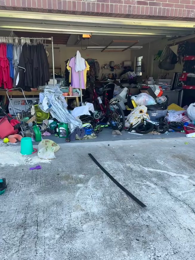 Before — This busy client runs her small business from the garage but had no room to work. In a single day we built her a dedicated workspace with a clear craft and project station, plus organized zones for clothing, sports gear, bikes, tools, and everyday storage — so she can sit down and start working the moment she walks in.